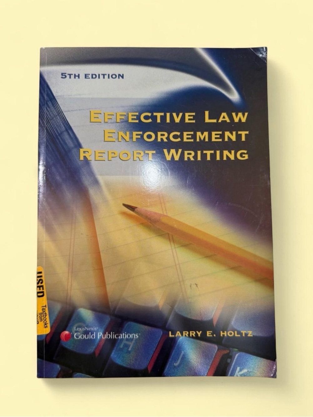 Effective Law Enforcement Report Writing — Blue/Yellow Cover by Larry E. Holtz.